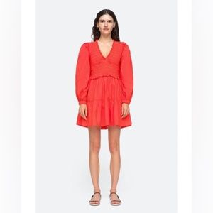 Red mini dress fitted top half and more flowy bottom of dress